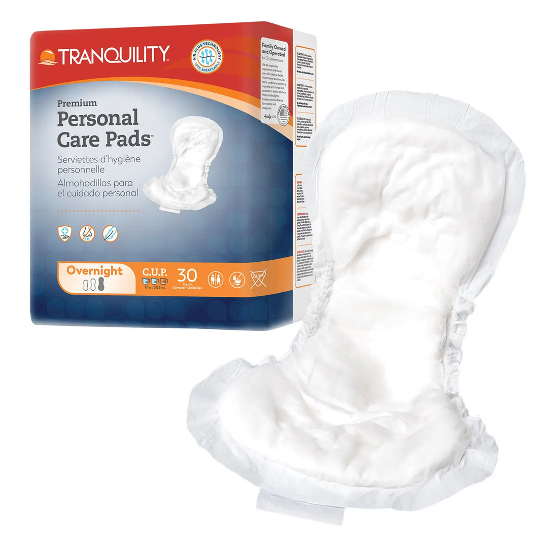 Tranquility Personal Care Pads 30-count package displayed next to an unfolded 16 inch heavy overnight absorbency incontinence pad